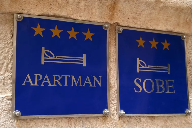 Dubrovnik, Croatia, october 25, 2023 Signs indicating apartment and room rental in Croatian languageapartmani, sobe, soba, renta, rentijerstvo, rentijeri, najam apartmana, turizam