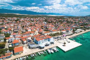 Town of Novalja waterfront on Pag island aerial view, Dalmatia region of Croatia