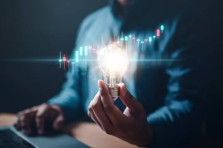 chart, graph, invention, bulb, invest, leadership, marketing, solution, strategy, glowing. A person is holding a light bulb. Concept of innovation and creativity with new ideas and inventions.