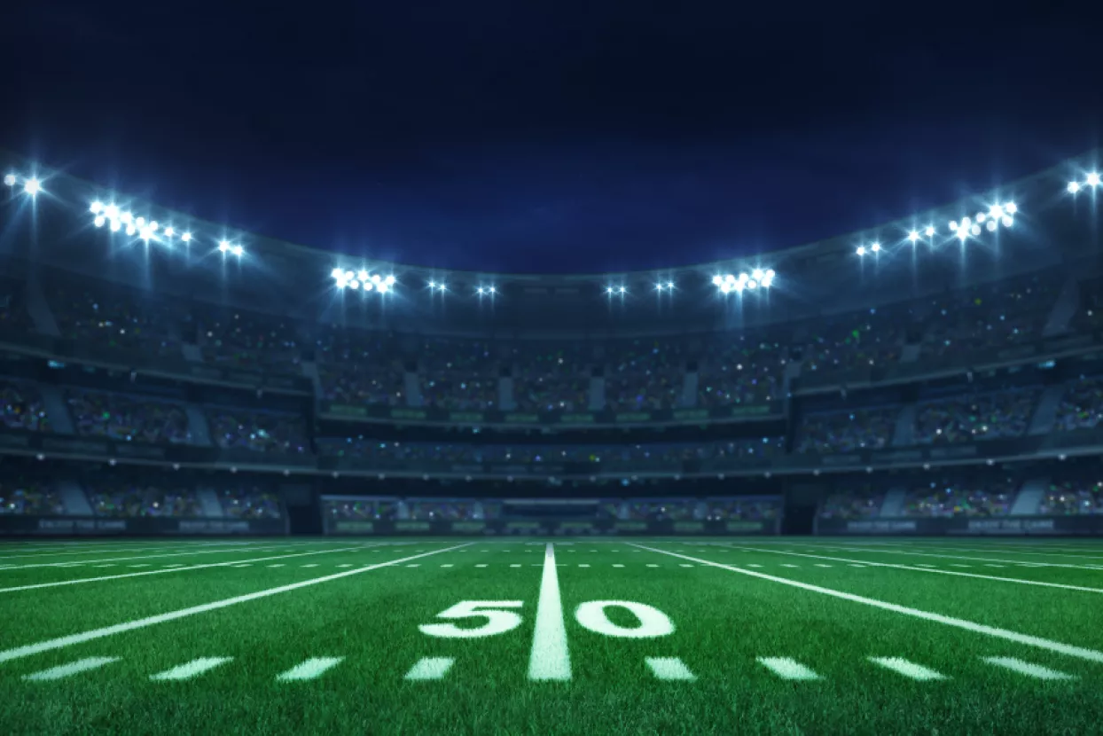 American football league stadium with white lines and fans, illuminated field side view at night, sport building 3D professional background illustrationSuper Bowl Half Time Show