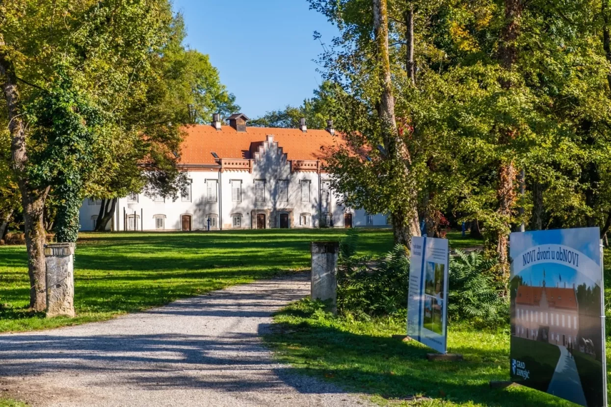 Novi Dvori, Zapre&scaron;ić, Croatia, October 22nd, 2023A picturesque entrance to the main building of Novi Dvori estate, surrounded by lush greenery and signs of restoration.